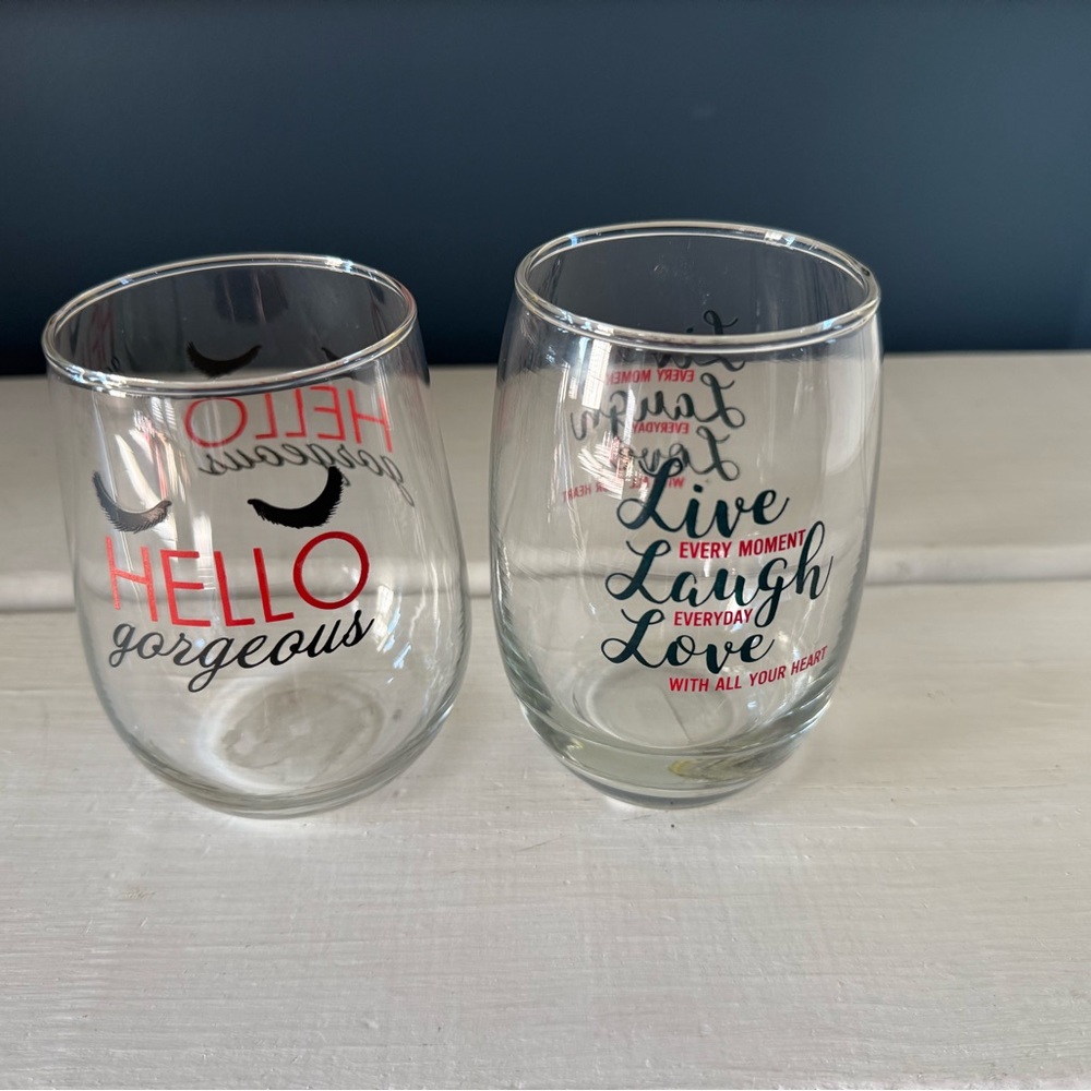 Set of Two Clear Stemless Wineglasses with Red and Black Text